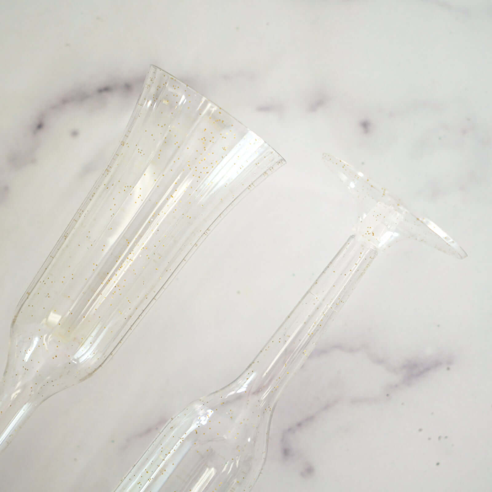 12-Piece Set of Lightweight 6oz Disposable Plastic Champagne Flutes with Clear/Gold Glitter Flared Design