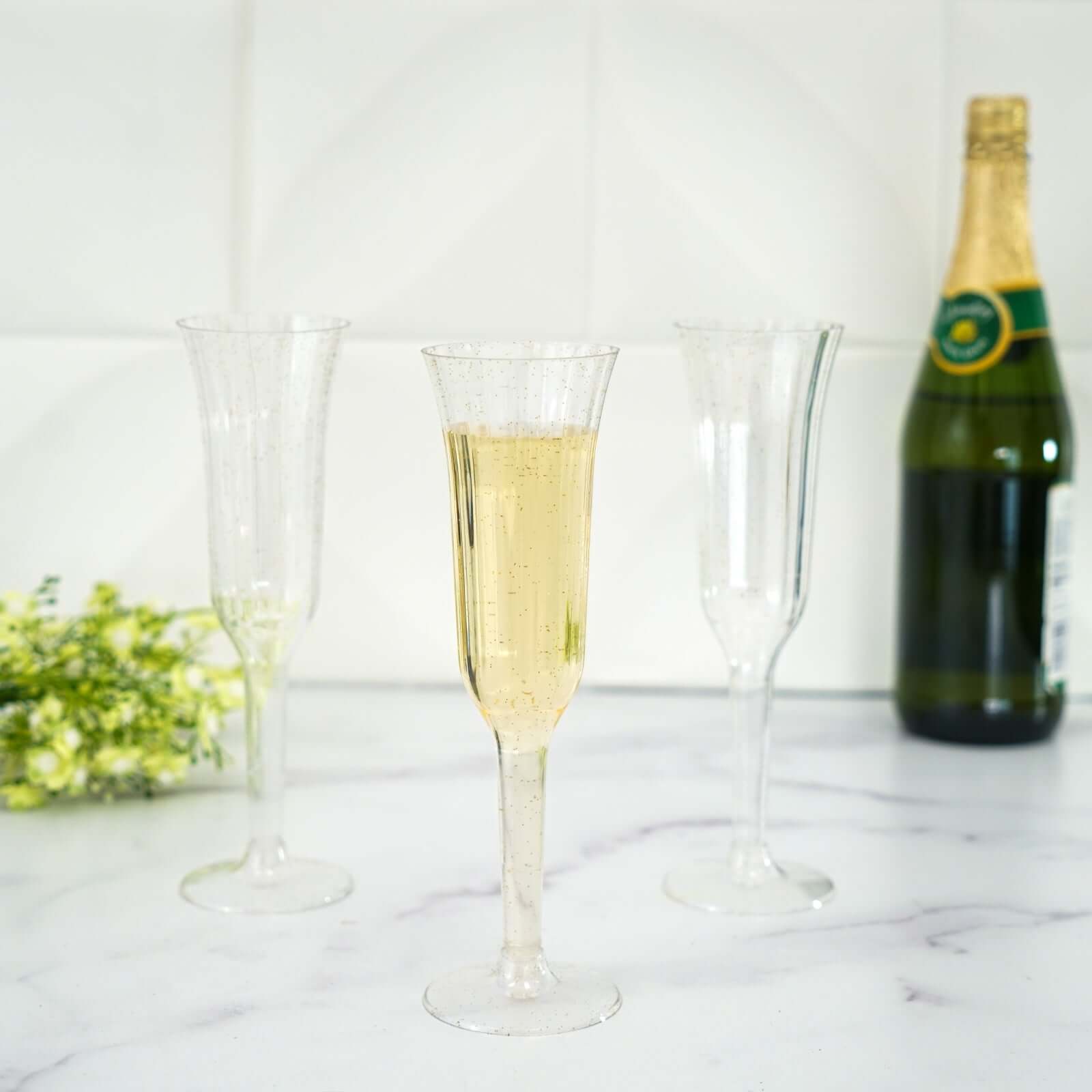 12-Piece Set of Lightweight 6oz Disposable Plastic Champagne Flutes with Clear/Gold Glitter Flared Design