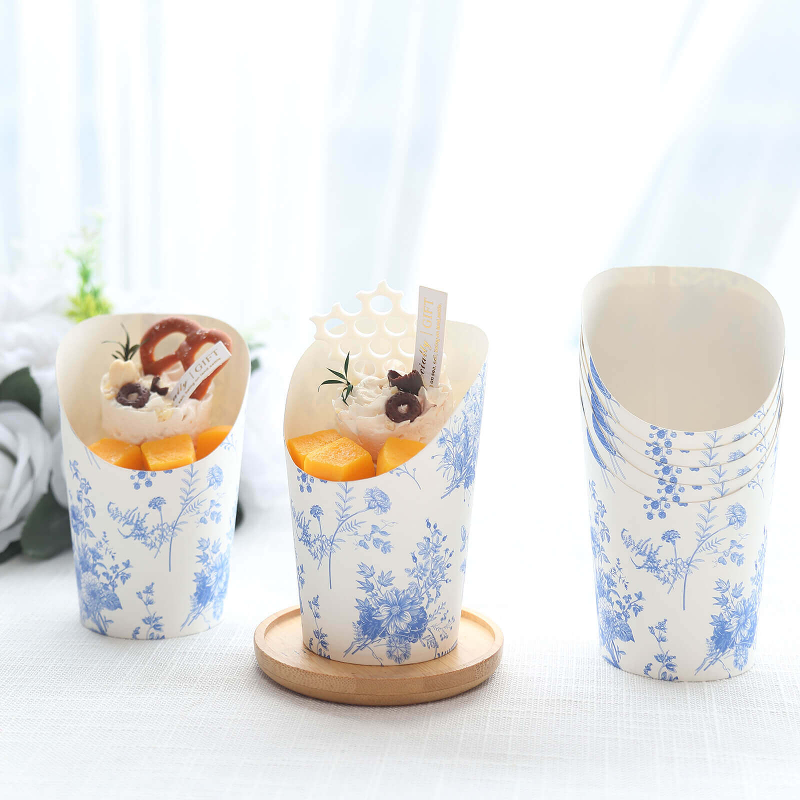 Get 50-Pack 14oz Paper Popcorn Box Cone Cups with French Toile Floral in White & Blue for Snacks