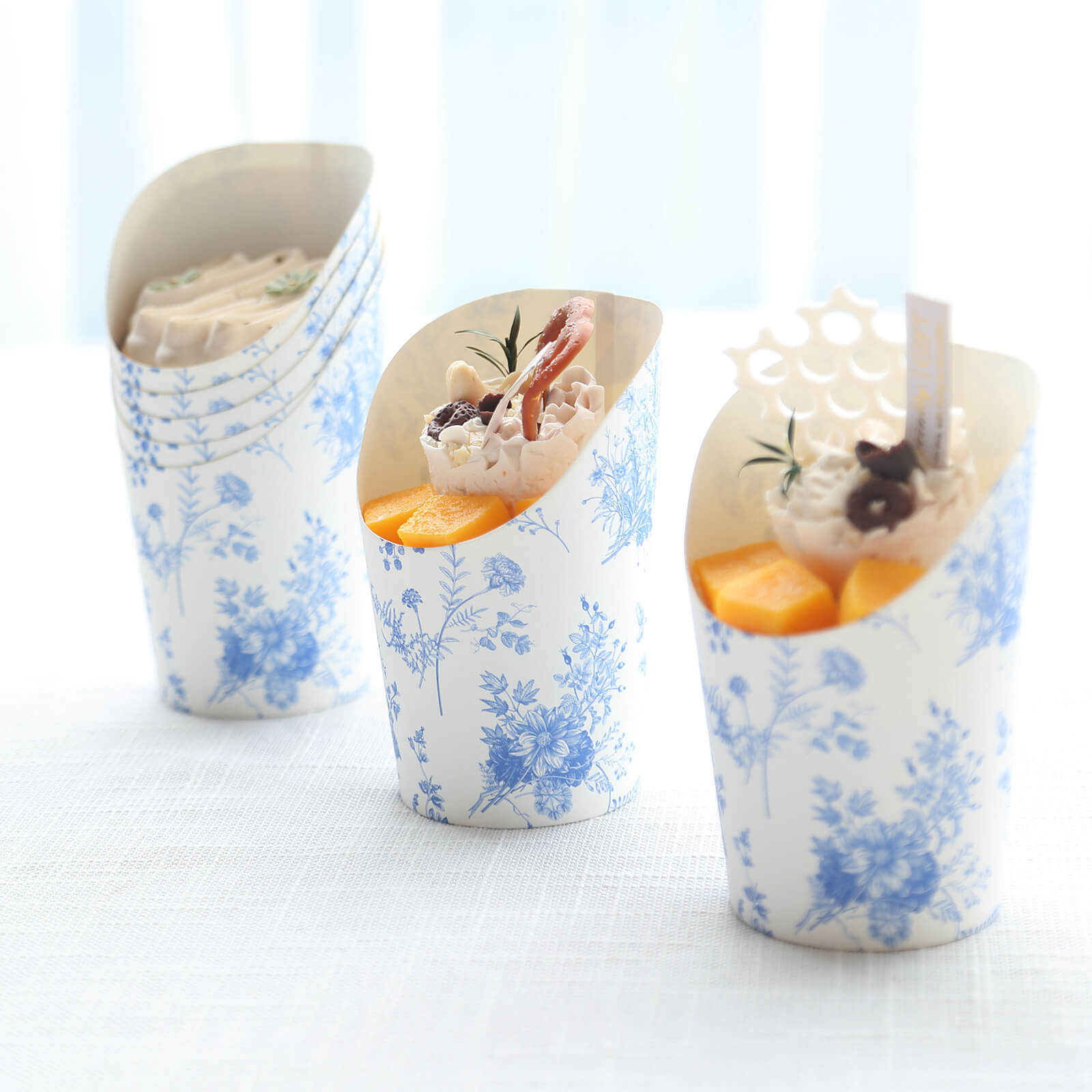 Get 50-Pack 14oz Paper Popcorn Box Cone Cups with French Toile Floral in White & Blue for Snacks