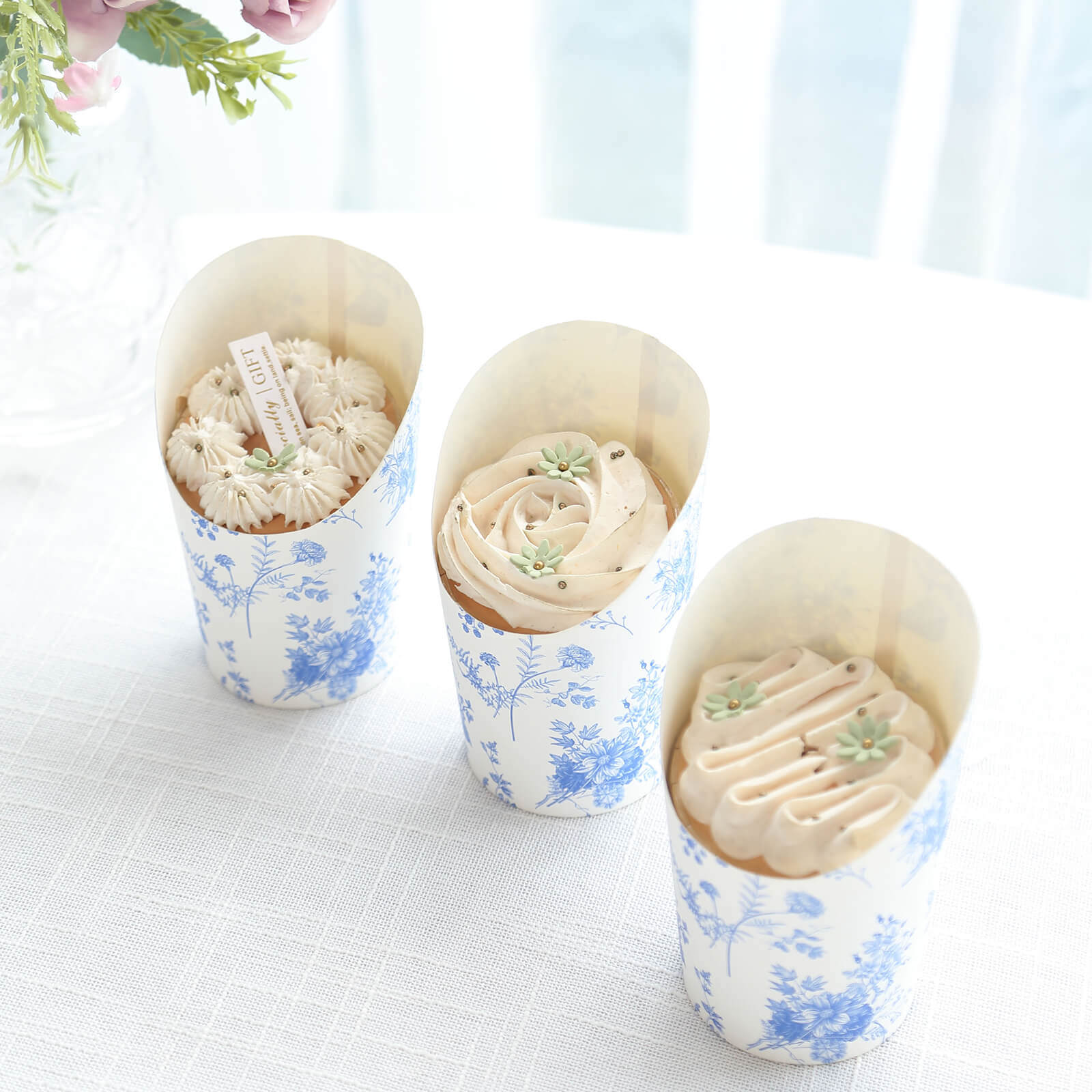 Get 50-Pack 14oz Paper Popcorn Box Cone Cups with French Toile Floral in White & Blue for Snacks