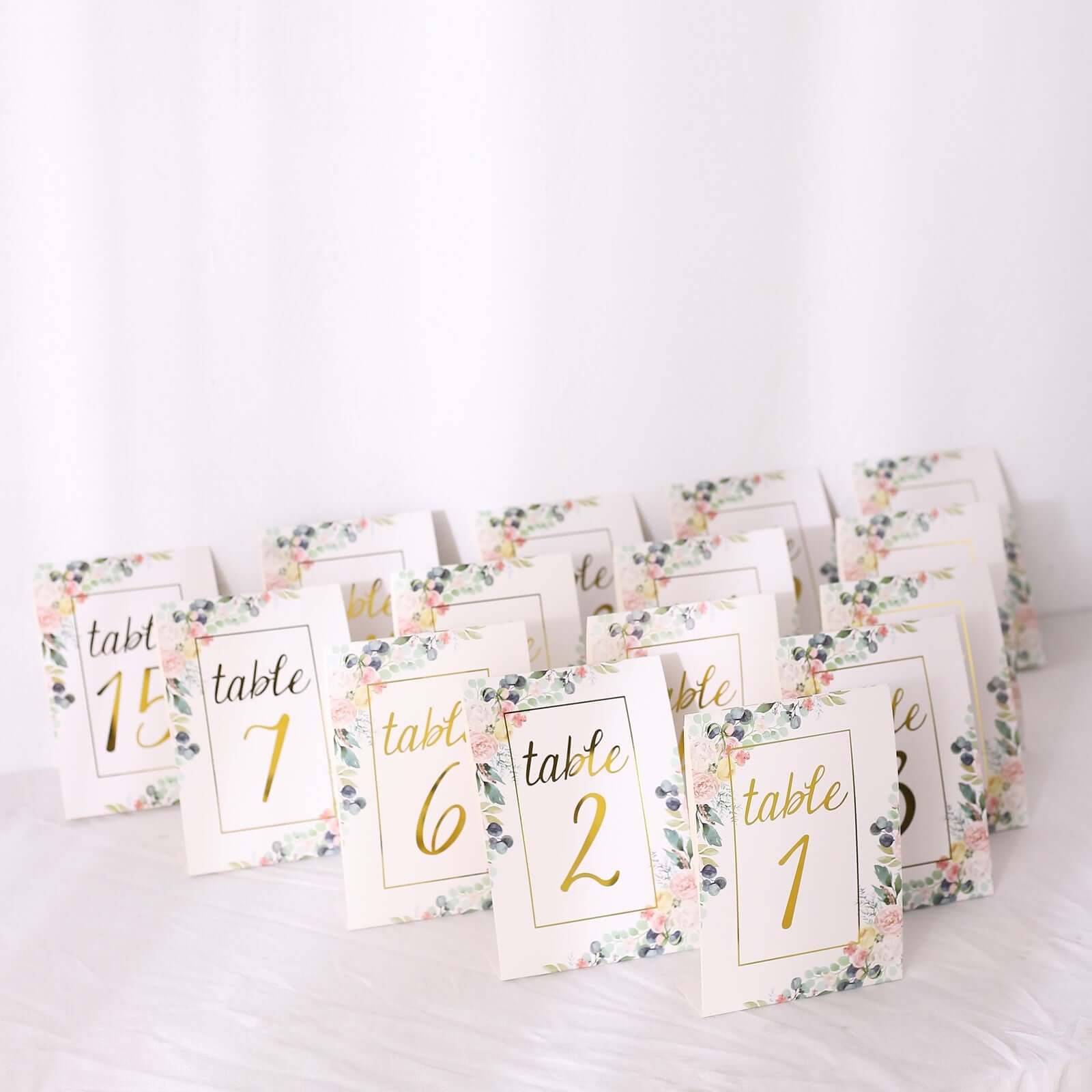 Get 25-Pack Free-Standing Double-Sided Wedding Table Numbers 1-25 with White Peony & Gold Foil Design