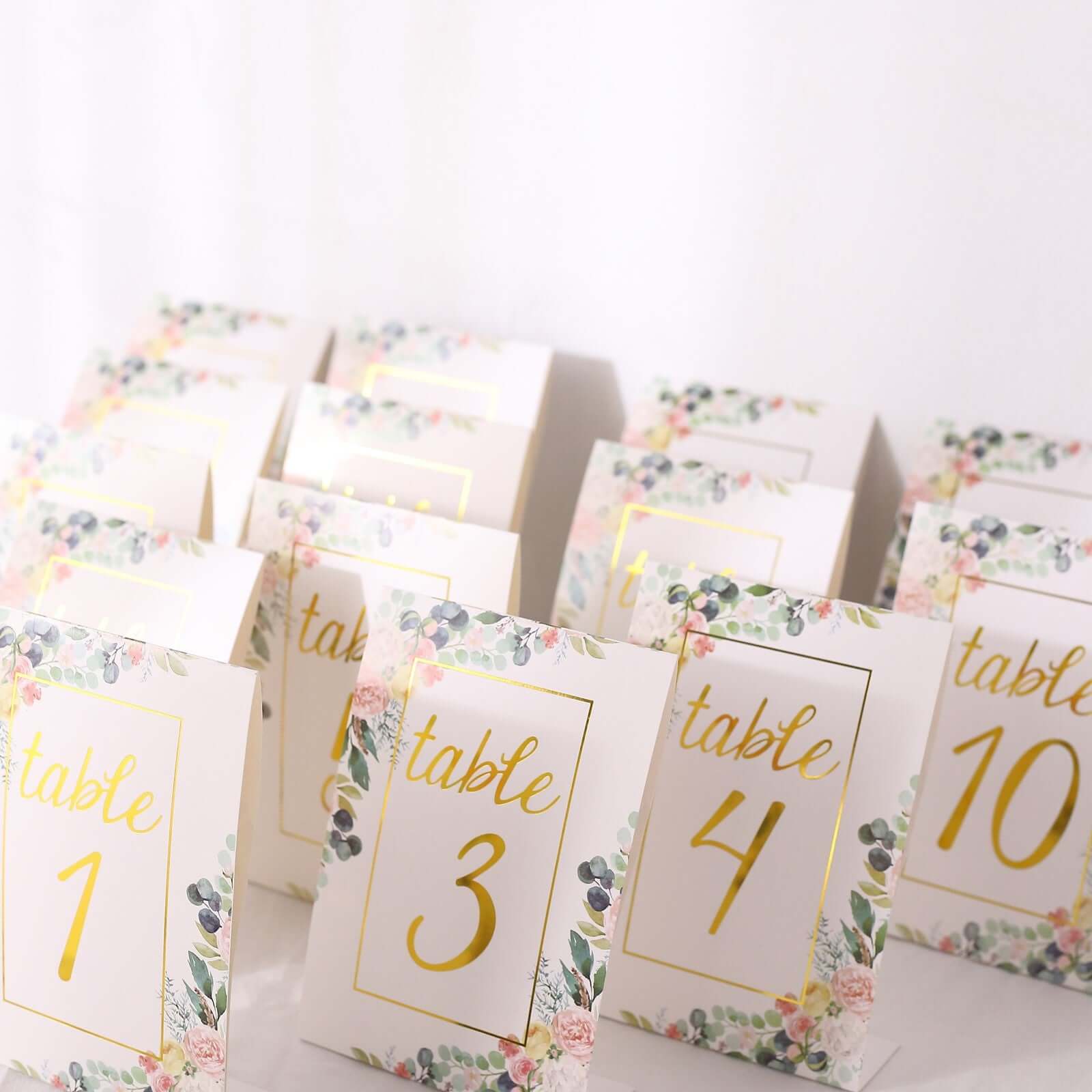 Get 25-Pack Free-Standing Double-Sided Wedding Table Numbers 1-25 with White Peony & Gold Foil Design