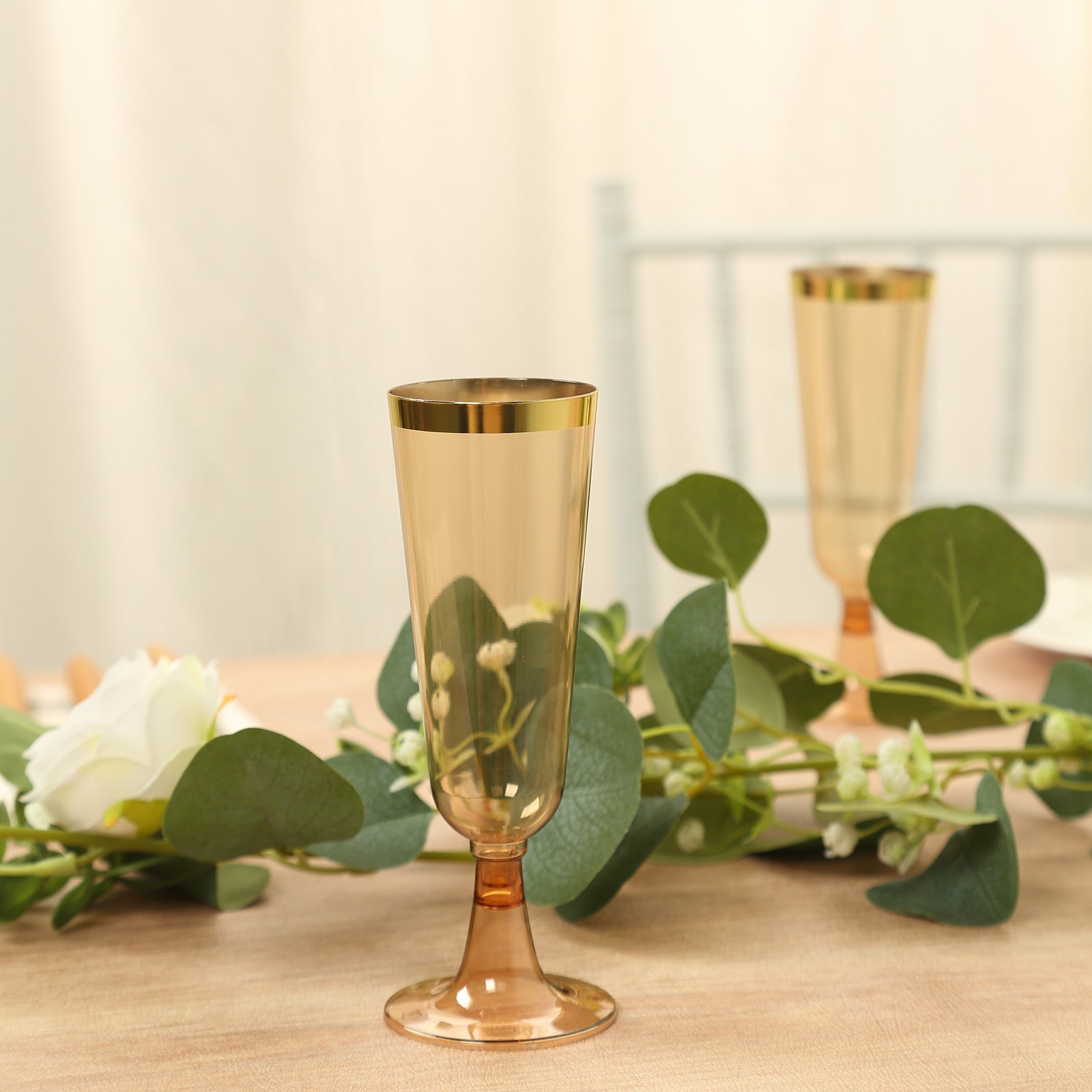 Stylish Disposable 5oz Plastic Champagne Flutes in Transparent Amber Gold with Gold Rim - 12-Pack for Parties