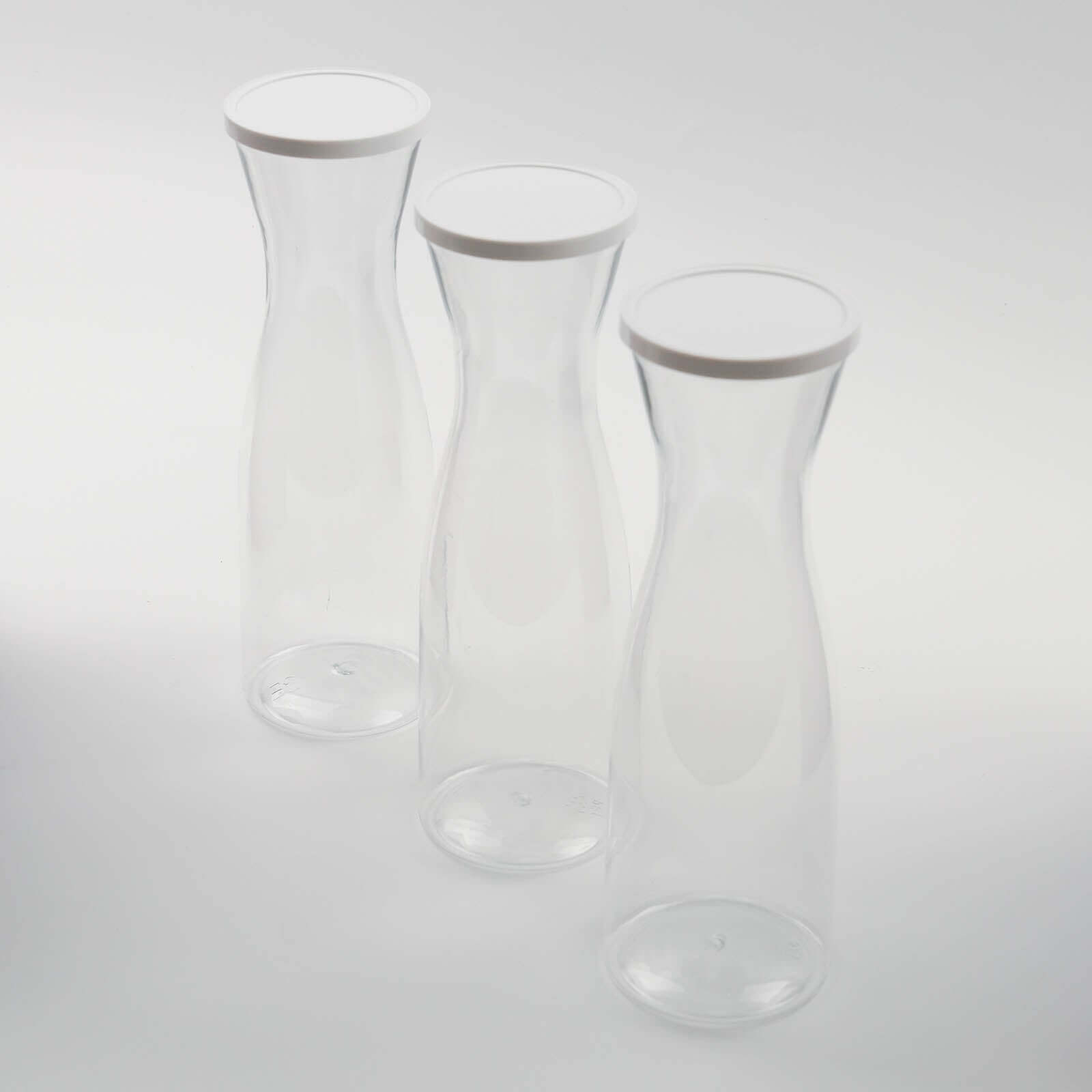 3-Pack Clear Plastic Water Carafes with White Lids - Durable 34oz Disposables for Outdoor Events