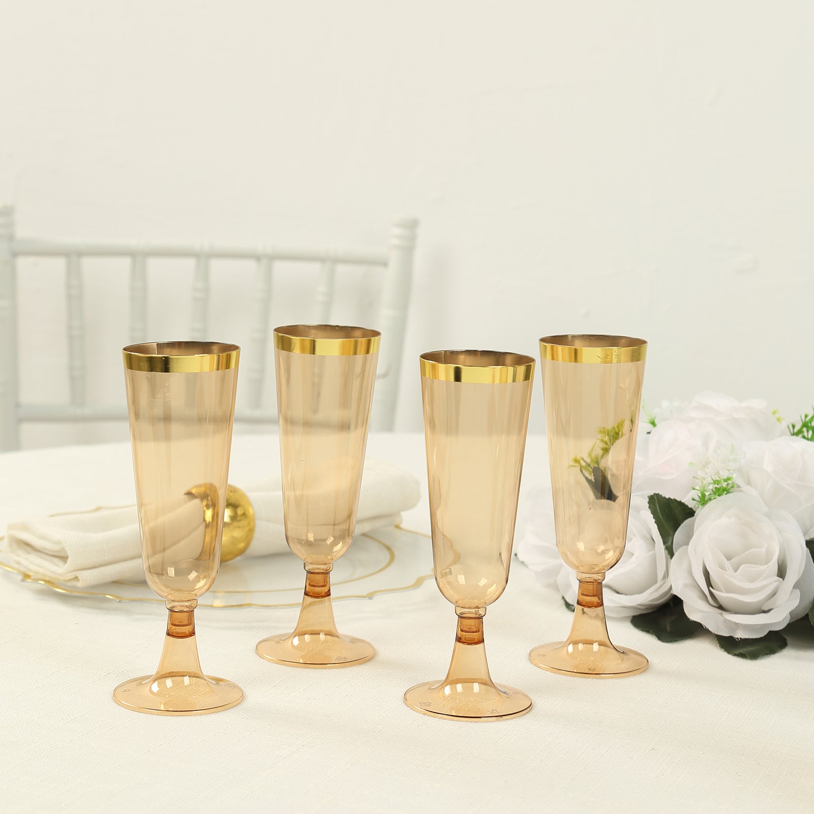 Stylish Disposable 5oz Plastic Champagne Flutes in Transparent Amber Gold with Gold Rim - 12-Pack for Parties