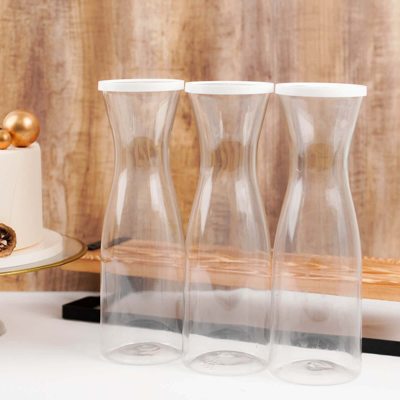 3-Pack Clear Plastic Water Carafes with White Lids - Durable 34oz Disposables for Outdoor Events