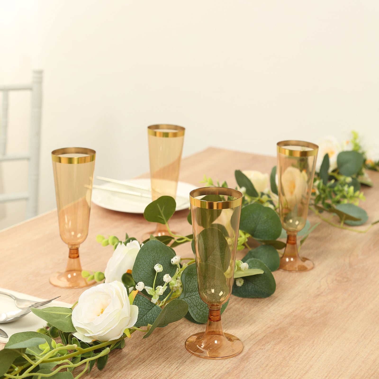 Stylish Disposable 5oz Plastic Champagne Flutes in Transparent Amber Gold with Gold Rim - 12-Pack for Parties