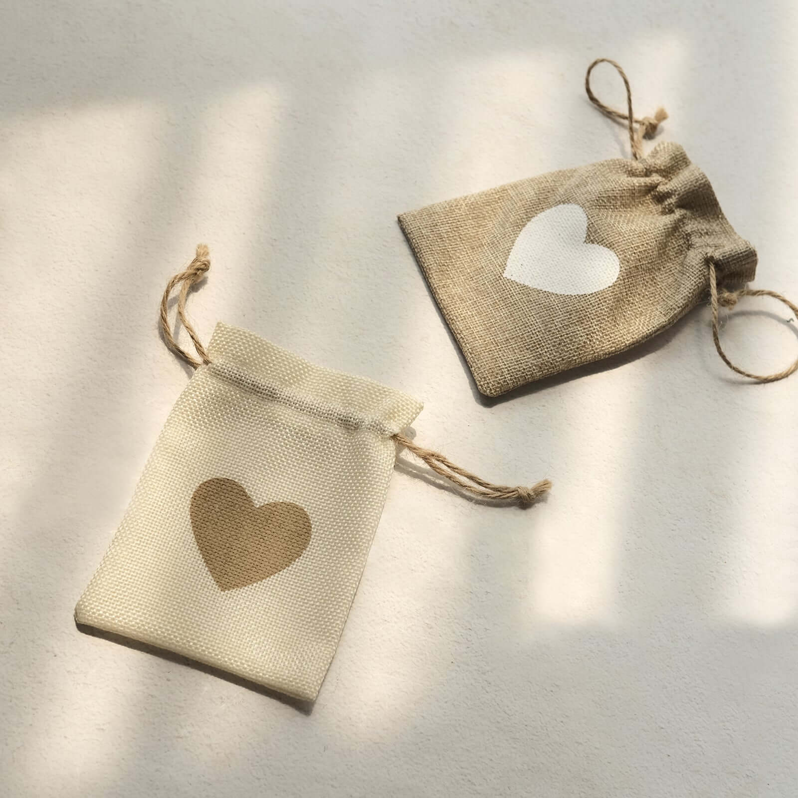 20-Piece Set of 4x5 Natural Ivory Heart-Printed Jute Burlap Drawstring Gift Bags for Rustic Weddings