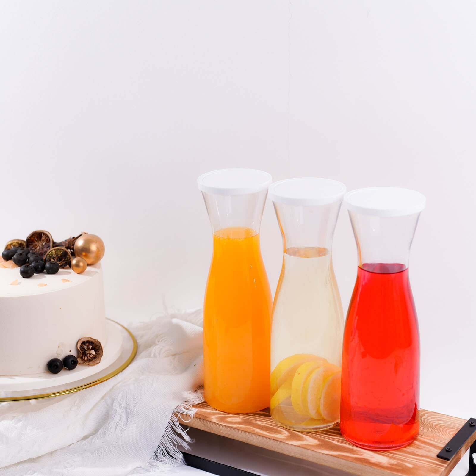 3-Pack Clear Plastic Water Carafes with White Lids - Durable 34oz Disposables for Outdoor Events