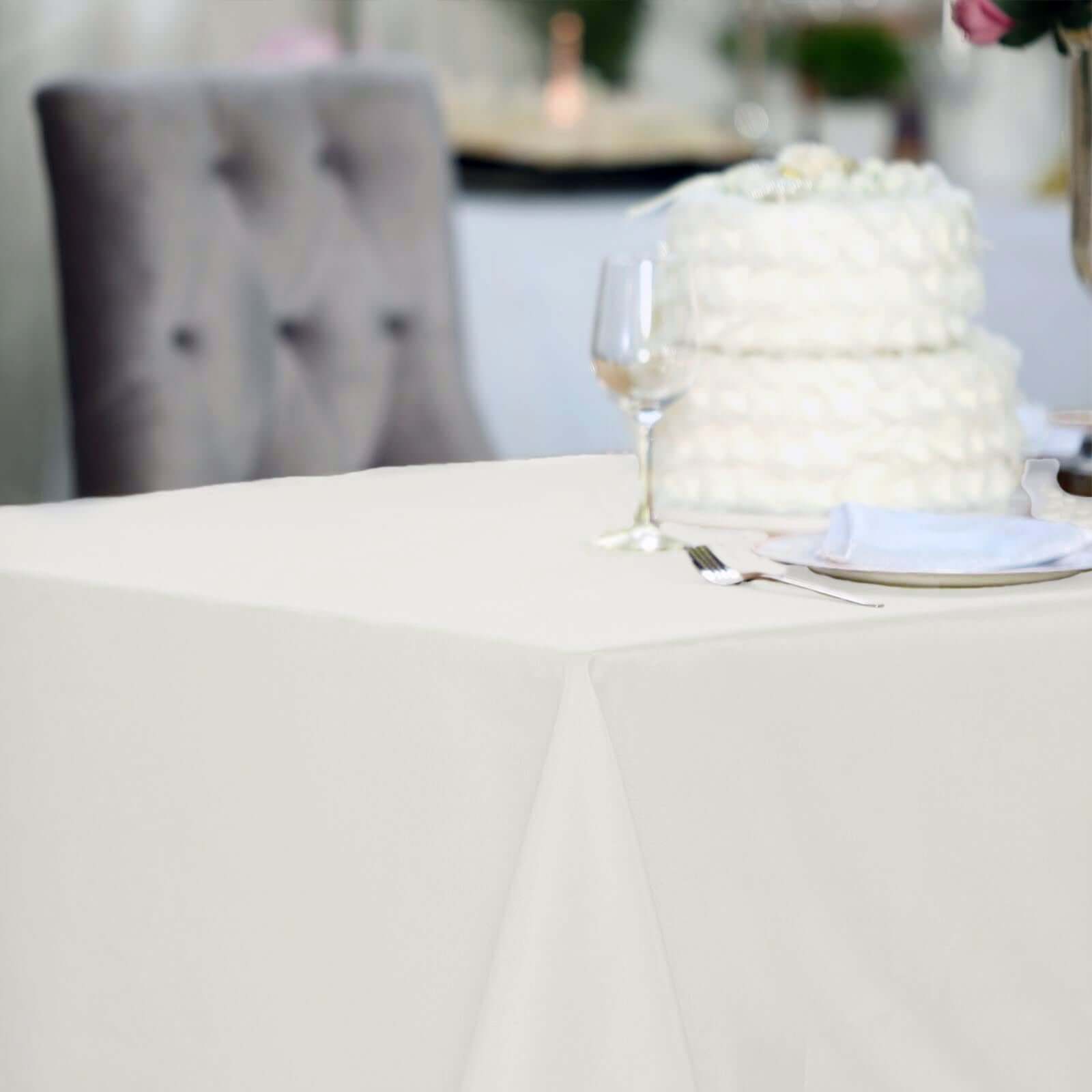 Durable and Elegant Ivory 60x102 Rectangle Polyester Tablecloth