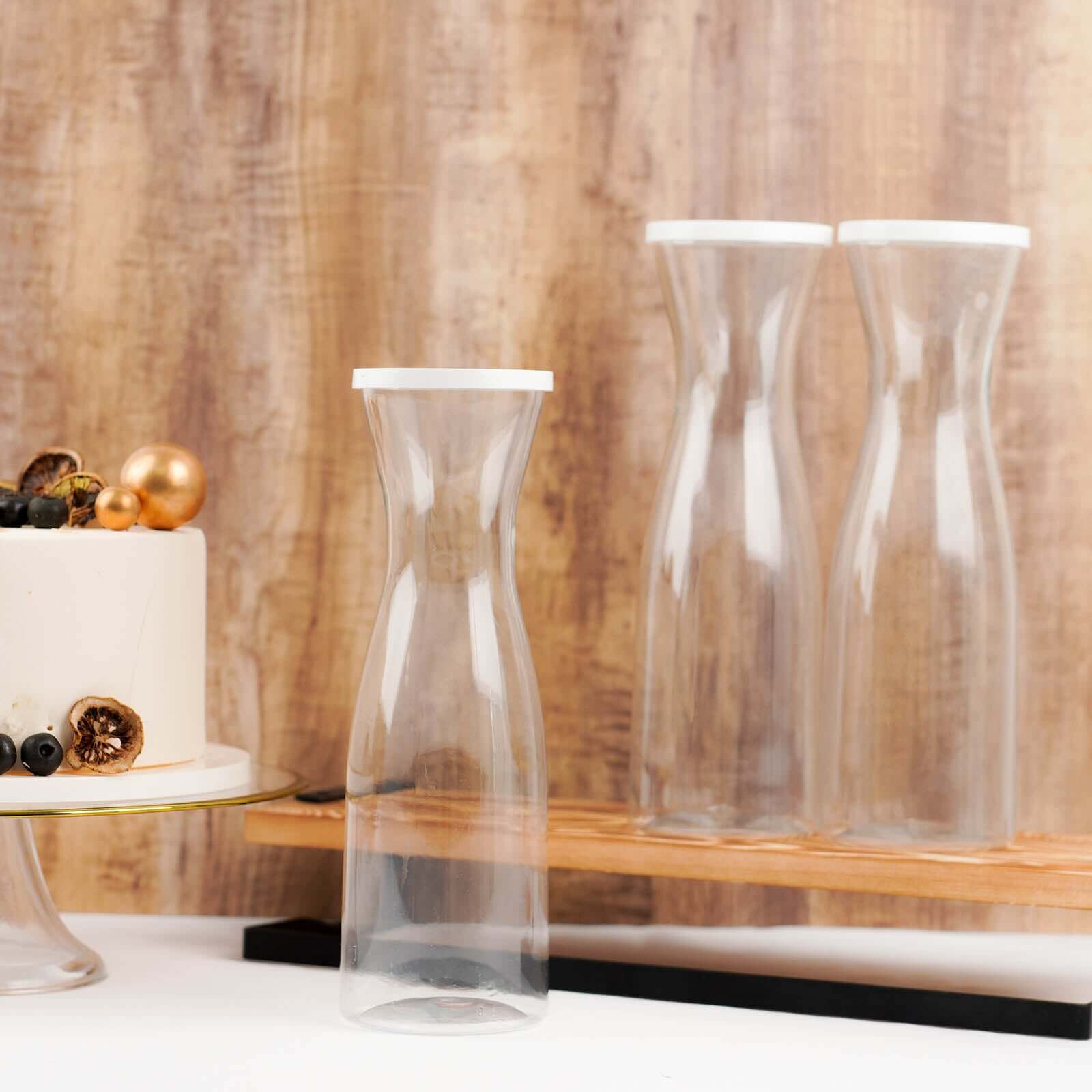 3-Pack Clear Plastic Water Carafes with White Lids - Durable 34oz Disposables for Outdoor Events