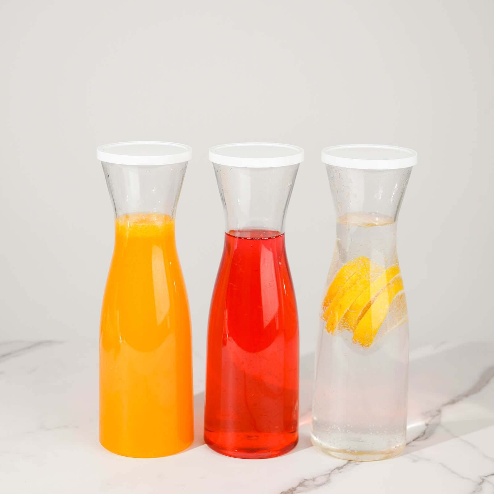 3-Pack Clear Plastic Water Carafes with White Lids - Durable 34oz Disposables for Outdoor Events