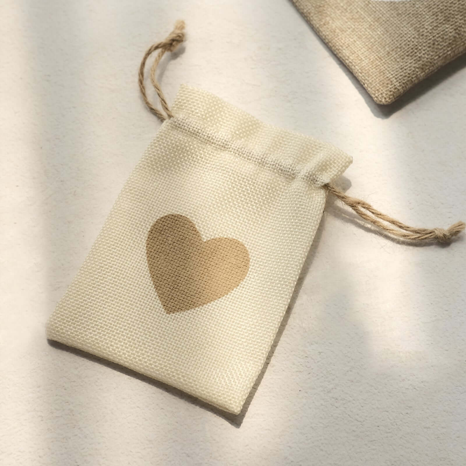 20-Piece Set of 4x5 Natural Ivory Heart-Printed Jute Burlap Drawstring Gift Bags for Rustic Weddings
