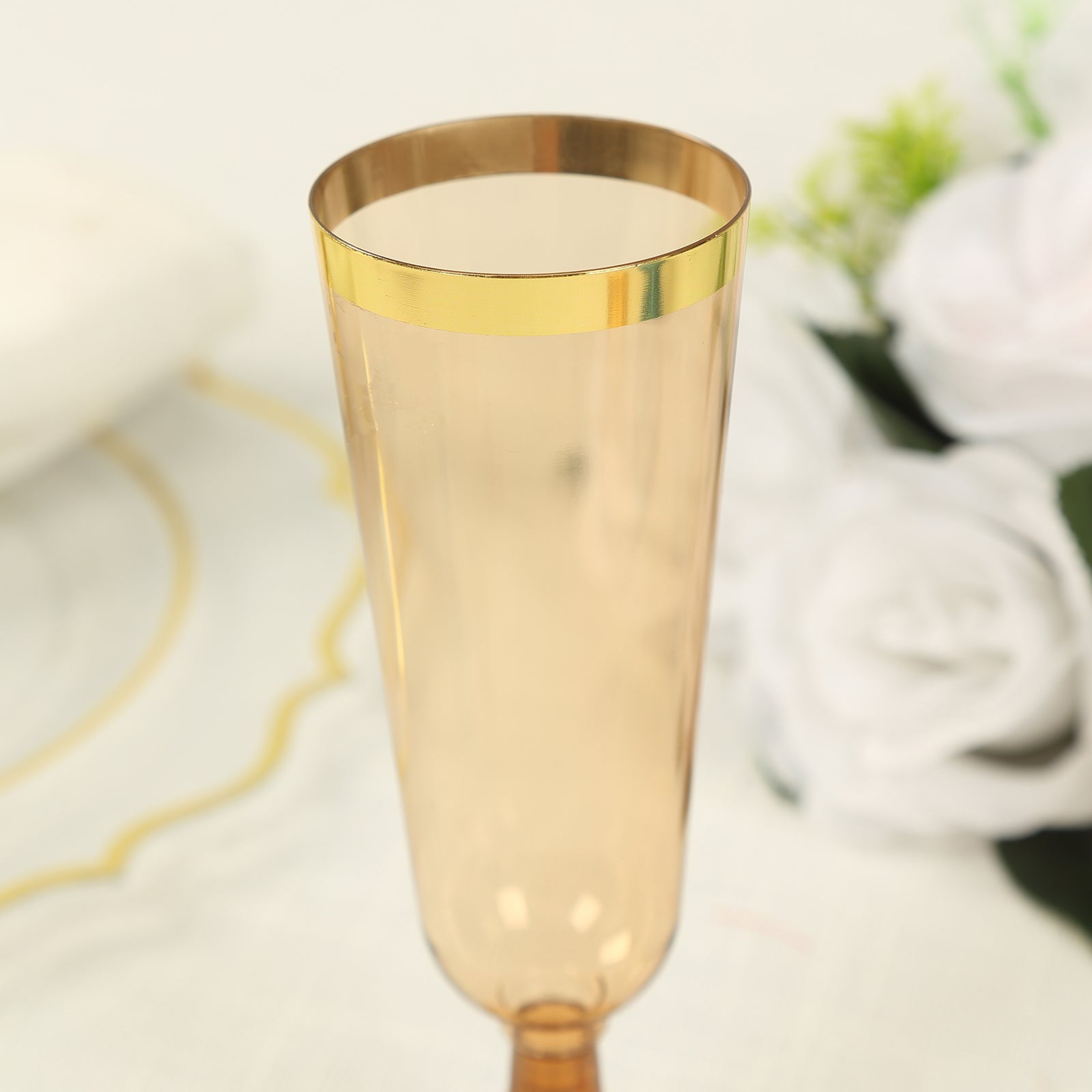 Stylish Disposable 5oz Plastic Champagne Flutes in Transparent Amber Gold with Gold Rim - 12-Pack for Parties