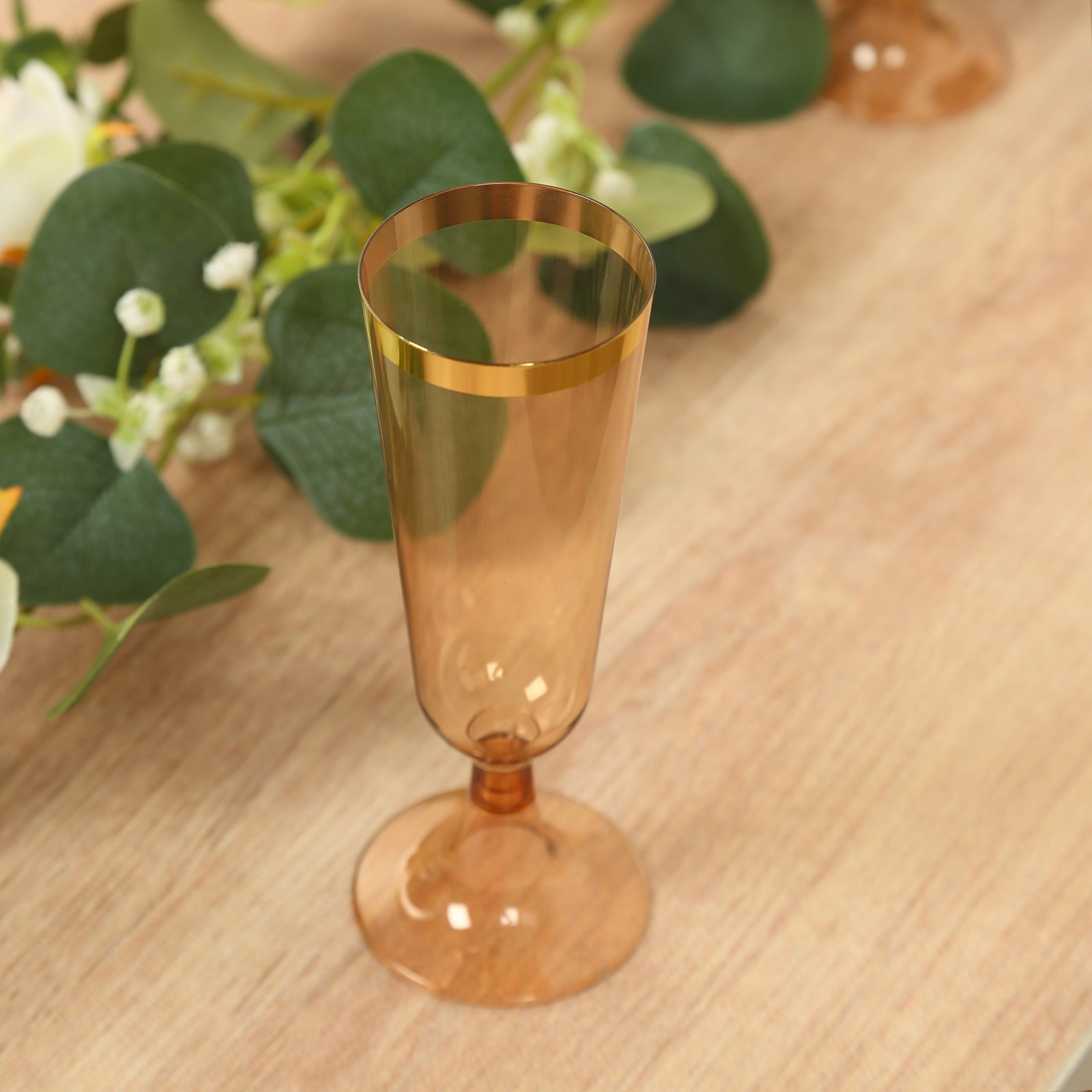Stylish Disposable 5oz Plastic Champagne Flutes in Transparent Amber Gold with Gold Rim - 12-Pack for Parties