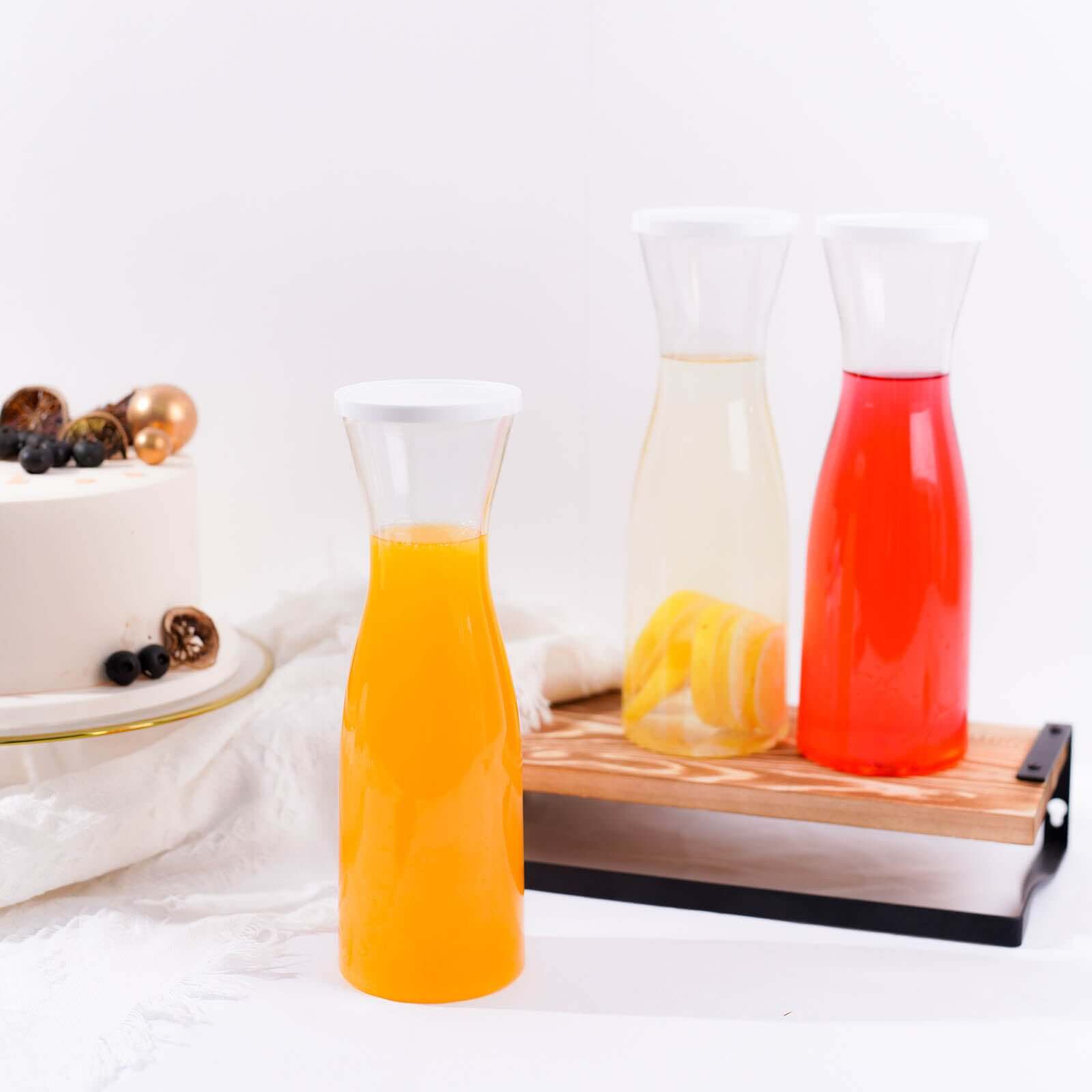 3-Pack Clear Plastic Water Carafes with White Lids - Durable 34oz Disposables for Outdoor Events